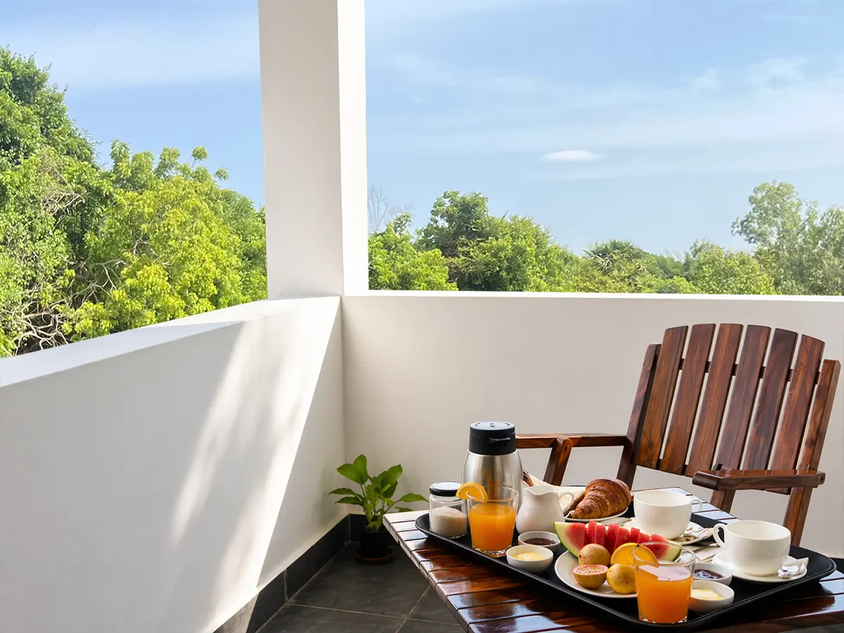 Breakfast on terrace surrounded by nature near Auroville